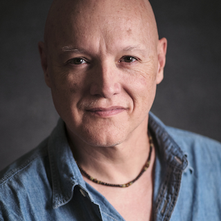Portrait of Stephen Howard BSc MChiro, creator of the Reflex training device, smiling.